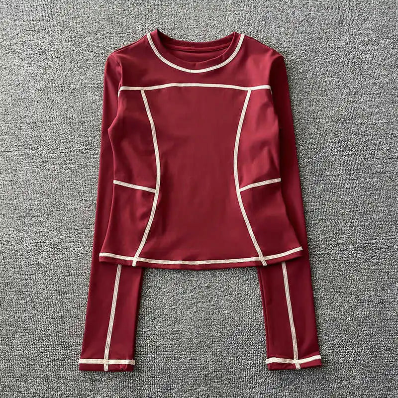 Curved yoga clothing for women; long-sleeved training tops that are quick-drying, slimming, and fashionable; suitable for runnin