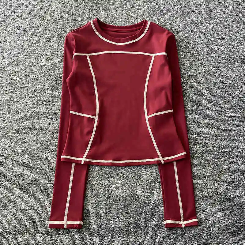 Curved yoga clothing for women; long-sleeved training tops that are quick-drying, slimming, and fashionable; suitable for runnin