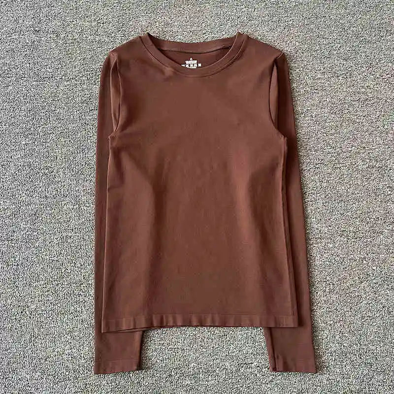 New autumn and winter yoga clothes nude solid color long sleeved women's quick drying running training Pilates sports slimming t