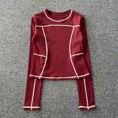 Curved yoga clothing for women; long-sleeved training tops that are quick-drying, slimming, and fashionable; suitable for runnin