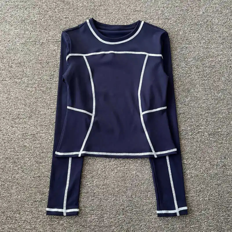 Curved yoga clothing for women; long-sleeved training tops that are quick-drying, slimming, and fashionable; suitable for runnin