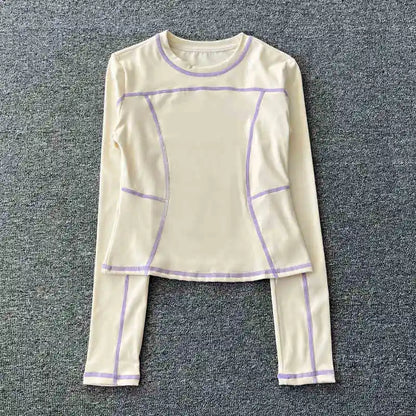 Curved yoga clothing for women; long-sleeved training tops that are quick-drying, slimming, and fashionable; suitable for runnin