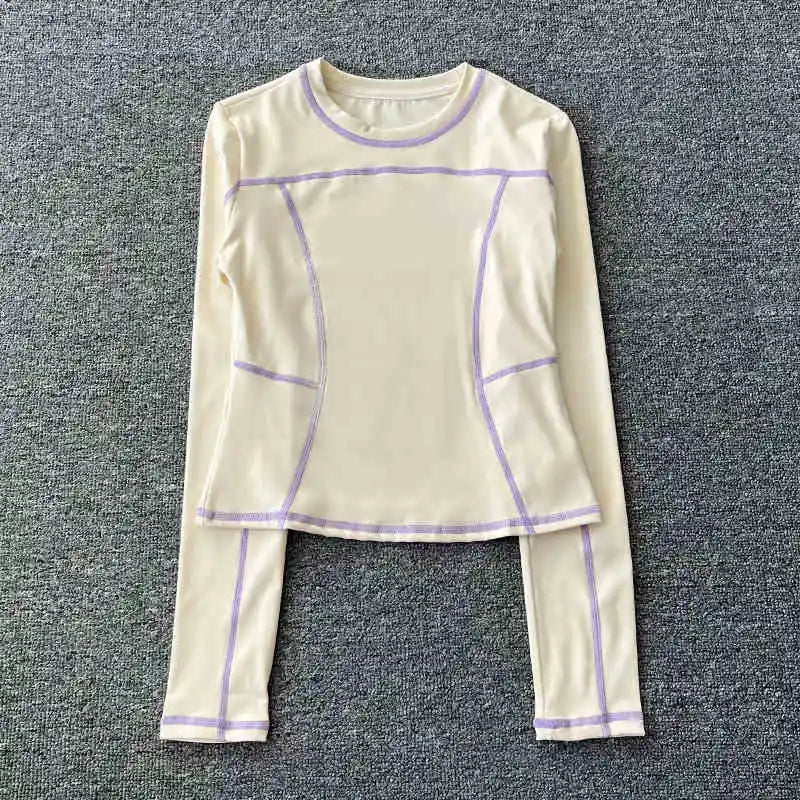 Curved yoga clothing for women; long-sleeved training tops that are quick-drying, slimming, and fashionable; suitable for runnin